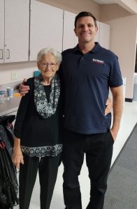 FOCCL Hospitality Volunteer Flo posed with Greg Rule at Sept. General Meeting (2) FOCCL Hospitality Volunteer Flo posed with Greg Rule at Sept. General Meeting